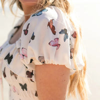 Manche robe papillon