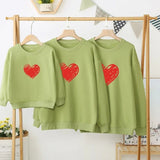 pull vert coeur rouge