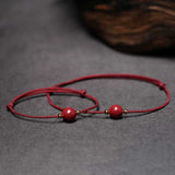 bracelet fin pierre rouge