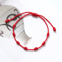 Bracelet fil rouge